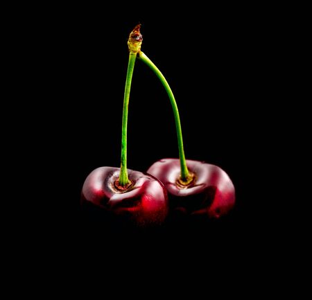 Fresh ripe Cherry close-up isolated on blackの写真素材