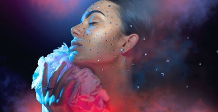 Beauty Woman face decorated with gem stones, crystals, diamondsの写真素材