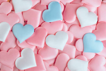 Valentine's Day Hearts Background. Holiday Abstract Valentine Background with pink, white and blue pastel color satin Hearts. Hearts backdrop. Love concept, wedding. Flat layの写真素材