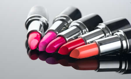Lipstick. Fashion Colorful Lipsticks over black background. Lipstick tints palette, Professional Makeup and Beauty. Beautiful Make-up concept. Lipgloss.の写真素材