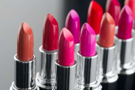 Lipstick. Fashion Colorful Lipsticks over black background. Lipstick tints palette, Professional Makeup and Beauty. Beautiful Make-up concept. Lipgloss.の写真素材