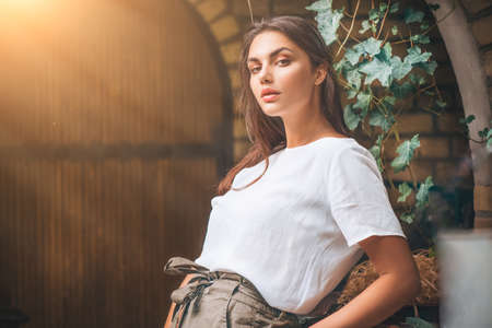 Beauty model girl posing in trendy fashionable spring clothesの写真素材
