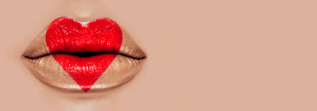 Valentine Heart Kiss on the Lips. Makeup. Beauty Sexy Lips with Heart Shape paint. Valentines Day. Beautiful Love Make-up. Wide screenの写真素材
