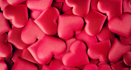 Valentine's Day Background. Holiday Abstract Valentine Background with red satin Hearts. Heart Shape Backdrop. Love concept.の写真素材