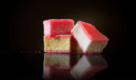 Marshmallow candy on black background. Colorful sweets candies close-up. Closeup.の写真素材