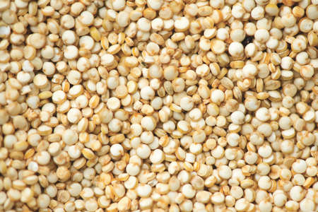 Quinoa White grains background, flat lay backdrop. Gluten free Healthy food. Diet, dieting concept. Seeds of white quinoa - Chenopodium quinoa. Flatlay, top view.の写真素材