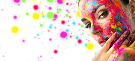 Fashion Model Girl colorful face paint. Beauty fashion art portrait, beautiful woman with painting smears, abstract makeup. Vivid paint make-up, bright colors. Multicolor creative make-up. Painterの写真素材