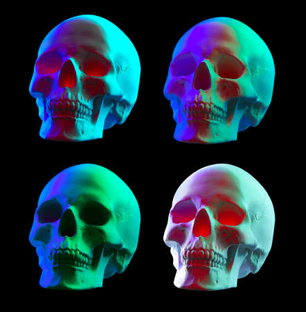 Halloween colorful human skulls close up. Scull isolated on black background. Witchcraft. Neon UV lightsの写真素材