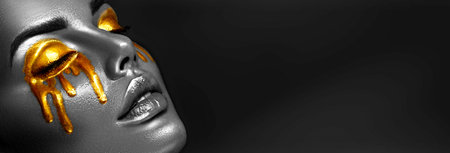 Gold Paint smudges drips on the face and eyes, dripping. Sexy lips, golden liquid drops on beautiful...