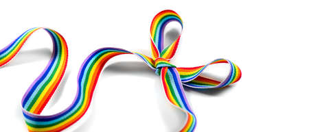 Colorful rainbow ribbon bow. LGBT colourful corner design, isolated on white background. Gay pride design. Ribbon or banner with flag of LGBTQ pride border. Inclusive concept. Gift bowの写真素材