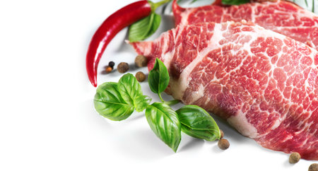 Raw meat isolated on white background. Premium marble beef steak. Prime fillet meat. gourmet food. Black Angus Steak Rib eye. Spicesの写真素材