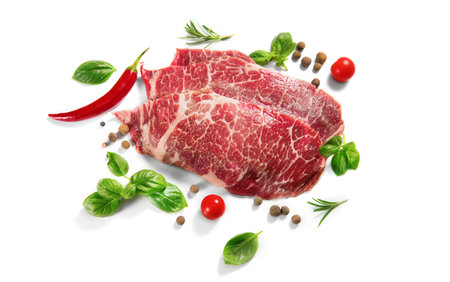 Raw meat isolated on white background. Prime fillet meat. Marble beef steak Black Angus Steak Rib eye. Spices. top view, aboveの写真素材