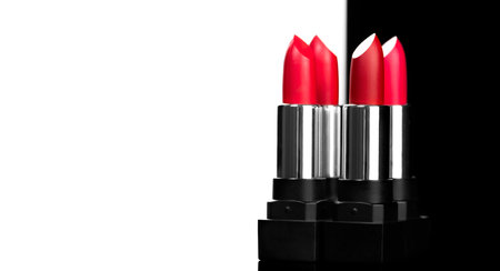 Lipstick. Fashion red Colorful Lipsticks isolated on black and white background. Red Matte lipstick tints palette, Professional Makeup and beauty. Beautiful Make-up design concept.の写真素材