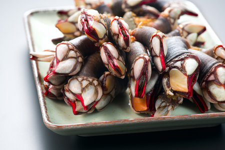 Barnacles, goose neck barnacle, percebes, gallician barnacles in a plate, close-up. Pollicipes pollicipes. Expensive delicatessen, gourmet sea food.の写真素材