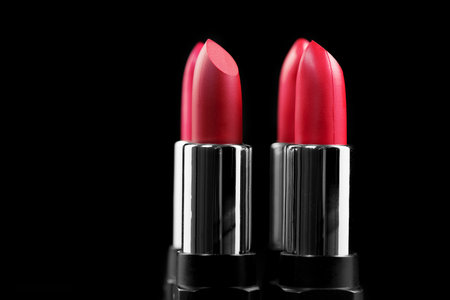 Lipsticks. Fashion red Colorful Lipstick isolated on black background. Red Matte lipstick tints palette, Professional Makeup and beauty. Beautiful Make-up concept. Lipgloss. Lipstiの写真素材