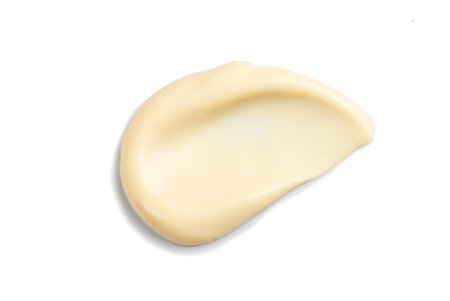 Mayonnaise smear close up. Tasty home made healthy vegan mayonnaise isolated on white background. White cream, sauce.の写真素材
