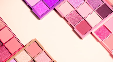 Makeup palette set isolated on beige background. Professional multicolor eyeshadow palette. Makeup. Professional multicolor eye shadow make-up palette, close-up. Various Colorful bの写真素材