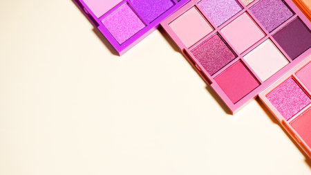 Makeup palette set isolated on beige background. Professional multicolor eyeshadow palette. Makeup. Professional multicolor eye shadow make-up palette, close-up. Various Colorful bの写真素材