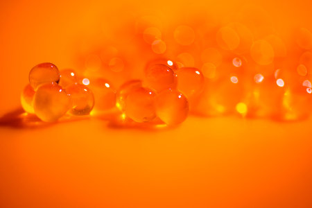 Red Caviar macro shot, Caviar over orange background. Fish roe, Close-up salmon or trout caviar....