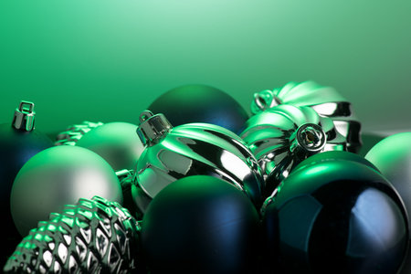 Christmas and New Year green color baubles decoration background.  Art design backdrop with holiday ball. Beautiful Christmas balls closeup. Copy space.の写真素材