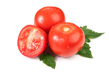 Tomato. Fresh Ripe natural tomatoes close-up. Organic tomato with leaves isolated on white background. Macro shot. Garden, Gardening concept. Ketchup, pasta, sauce ingredientの写真素材