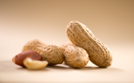 Peanuts. Unshelled nuts close up. Roasted pile of peanuts in shell. Organic vegan, vegetarian food....