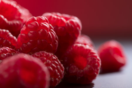 Raspberry fresh berries closeup, ripe fresh organic Raspberries over dark background, macro shot. Harvest concept, border designの写真素材