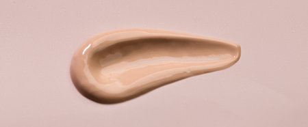 Makeup foundation, BB cream smear, cosmetic product over beige background. Make up base skin care, foundation, concealer smudge close up. Skin corrector, beauty facial treatment stの写真素材