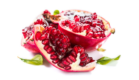 Pomegranate. Fresh juicy Pomegranates with leaves isolated on white Background. Organic Bio fruits closeupの写真素材