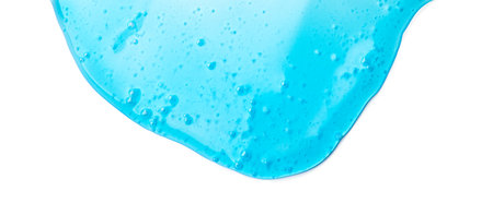 Blue liquid gel flowing, washing, shower fluid gel border, isolated on white background, dripping shampoo texture on white, body care cosmetic, texture of liquid gel, soap backdropの写真素材