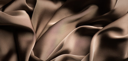 Silk, satin background. Chocolate brown color silk backdrop, folds, texture of beautiful dark beige...
