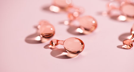 Revitalising capsules skin care for youthful skin, face serum, collagen Professional cosmetics. Face care, pink liquid-filled capsules. Beauty treatment.の写真素材