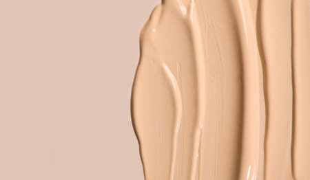 Foundation, concealer, face makeup smudge, smears border. Cosmetic liquid foundation or cream beige color smudges, stroke. Contouring, Make up background. Foundation texture surfacの写真素材