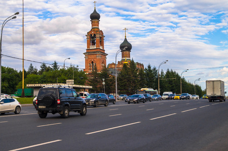 MOSCOW, RUSSIA, AUGUST, 27.2017: City traffic on the Volokolamsk highway in front of the Savior Transfiguration Church in Tushino.のeditorial素材