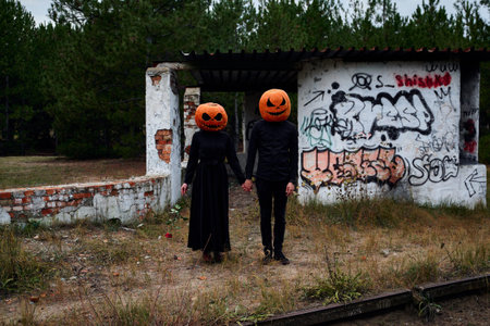Halloween boy and girl with pumpkins on their heads