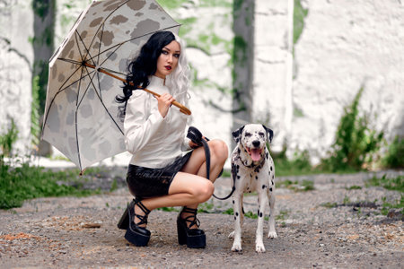 Cosplay on Cruella de Vil with a Dalmatianの写真素材
