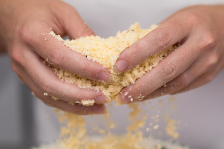 Homemade baking, kitchen scene showing Butter, Flour, Sugar and Vanilla Seeds being mixed to make shortbread biscuits, with womans hands.の写真素材