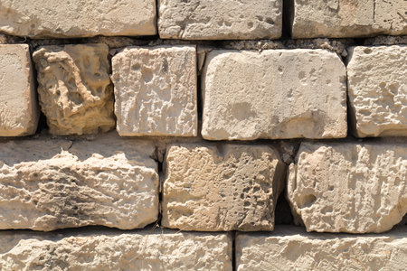Weathered globerigina limestone wall, large stone slabs, as can be seen all over Malta. Shot...