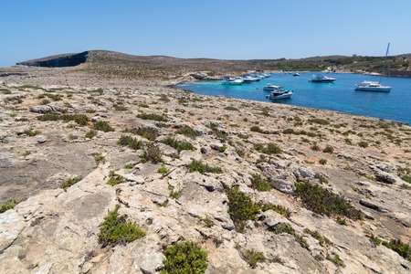 High Resolution Panorama of the crystal clear blue waters of Santa Maria Beach in Santa Marija Bay, a large quiet bay on the small holiday island of Comino, Malta, June 2017のeditorial素材
