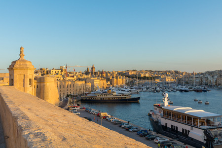 Beautiful Golden hour sunset light over dockyard creek and the Vittoriosa Yacht Marina, seen from Fort St Angelo, Birgu, malta, October 2016のeditorial素材