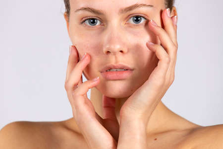 A womans beauty lies in clean, healthy skin and natural makeup. Natural Beauty. Spa concept, portrait on white backgroundの写真素材