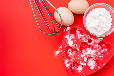 Wheat flour, baking dish and cupcake whisks for your breakfast. Valentines Day.の写真素材