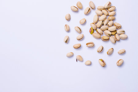 Pistachios on ultimate gray kitchen table. A healthy and nutritious snack.の写真素材