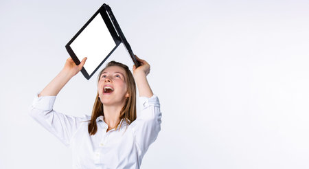 Banner,long format. Smiling business woman in white shirt holding laptop above her head like a roof,...