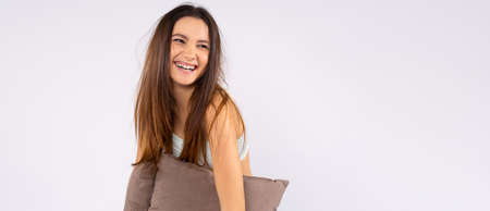 Banner- long format. Good morning. Spa and skin care, wellness concept. Relax your rest and self-care. Time for self-care. Wake up happy woman looking into distance on empty gray backgroundの写真素材