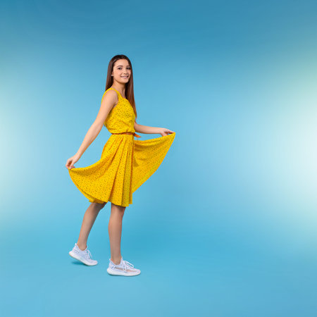 Beauty woman. Female model wear stylish design, illuminating color dress. Casual summer style for...