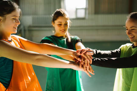 Hand for work together concept, Hand stack for team service, Volunteer or teamwork togetherness, Concept connection of community. Group of happy girls or team participation.の写真素材