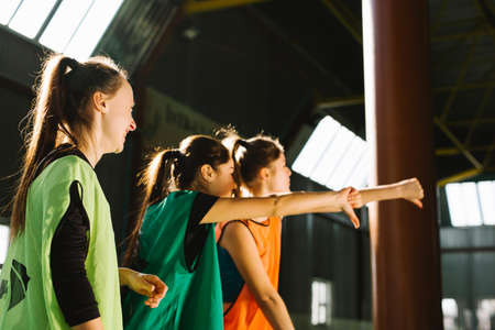 The crowd cheers at the basketball stadium. Fans on the basketball court in the game. Disappointed fans on tribune. Loss of their favorite team. Sport fans unhappy group people.の写真素材