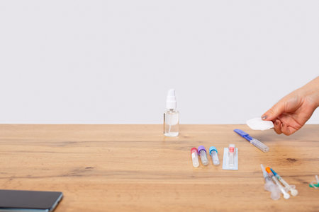 Medicine kit for blood test in professional clinic. Table with necessary equipment. Patient hand...