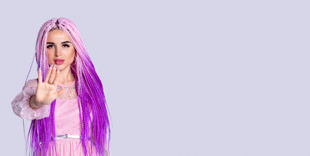 Banner, long format on grey background. Image of caucasian modern young woman, pink hair braids,...